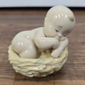 Nau baby in nest figurine